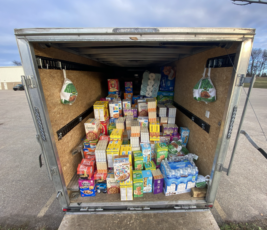 Everlight fills one of the company trailers with foods and goods to donate