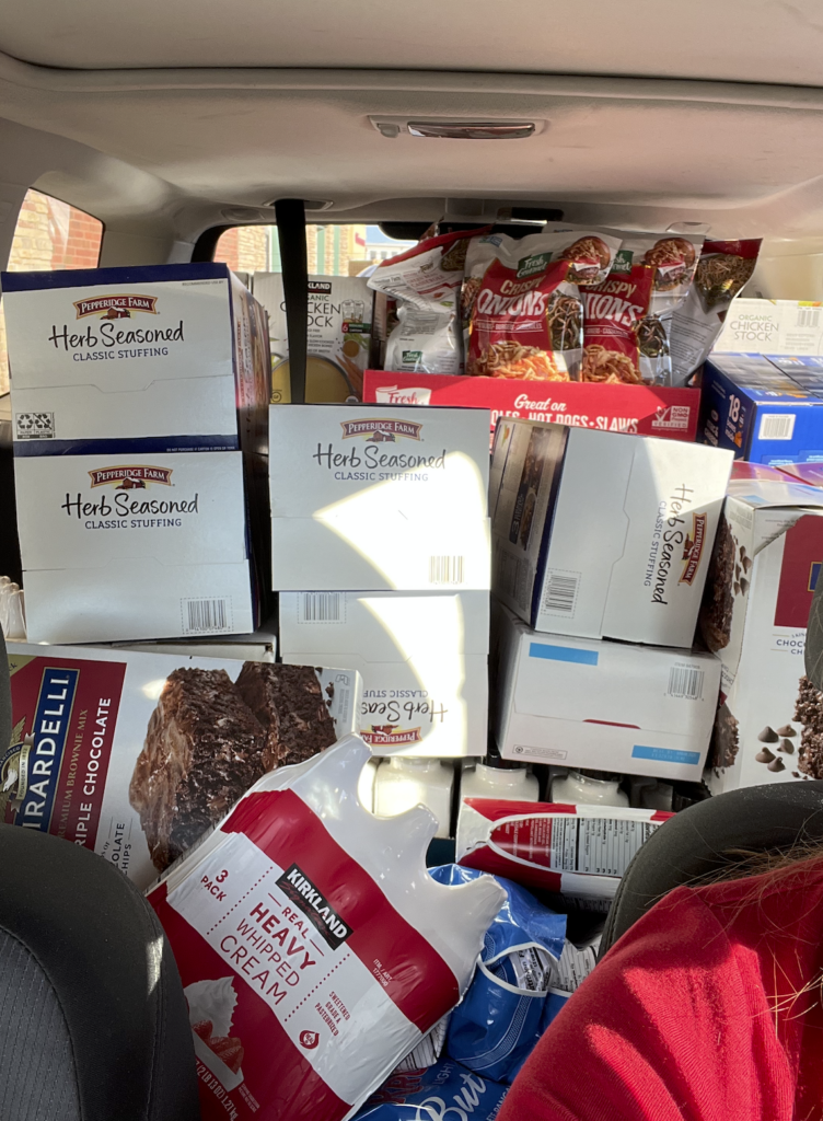 Cars are full of food to donate.