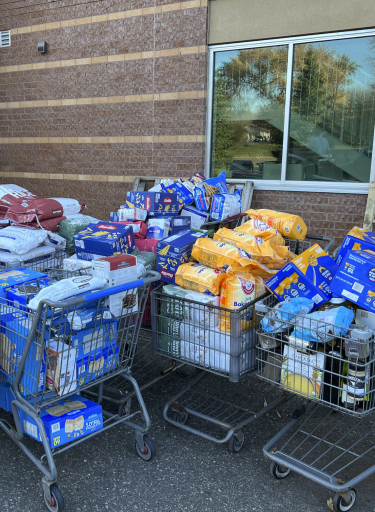 Shopping carts are filled with food to donate.
